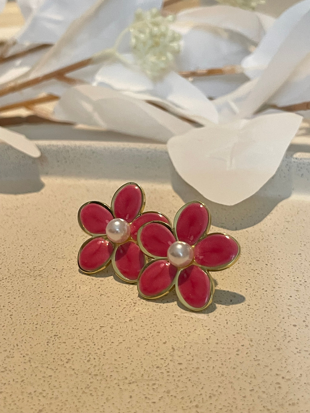 Boucle d’oreille fleur rose